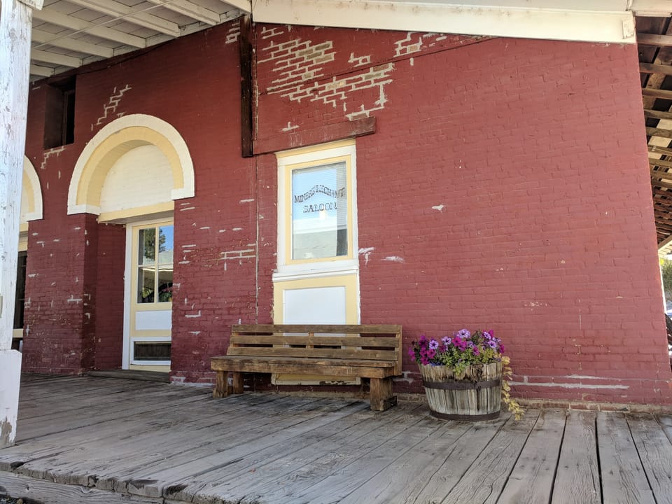 Front of the Miners Exchange saloon in Idaho City with replaced brick and patched joints awaiting paint